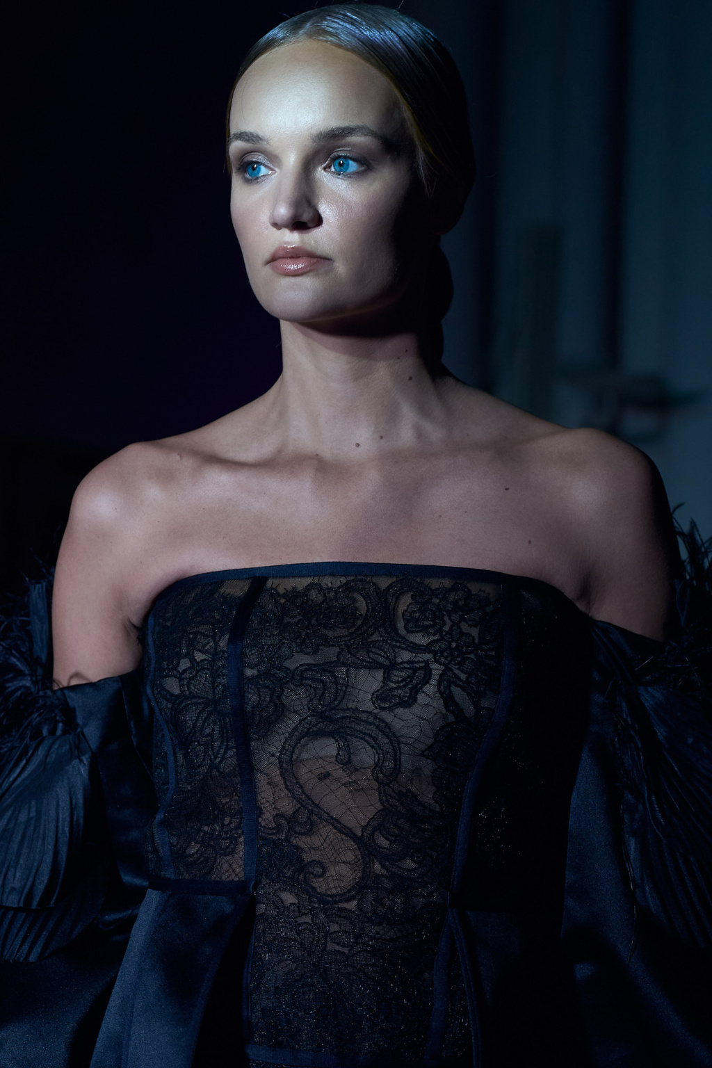 Fashion portrait, model wearing black satin dress with floral lace corset, dramatic low lighting